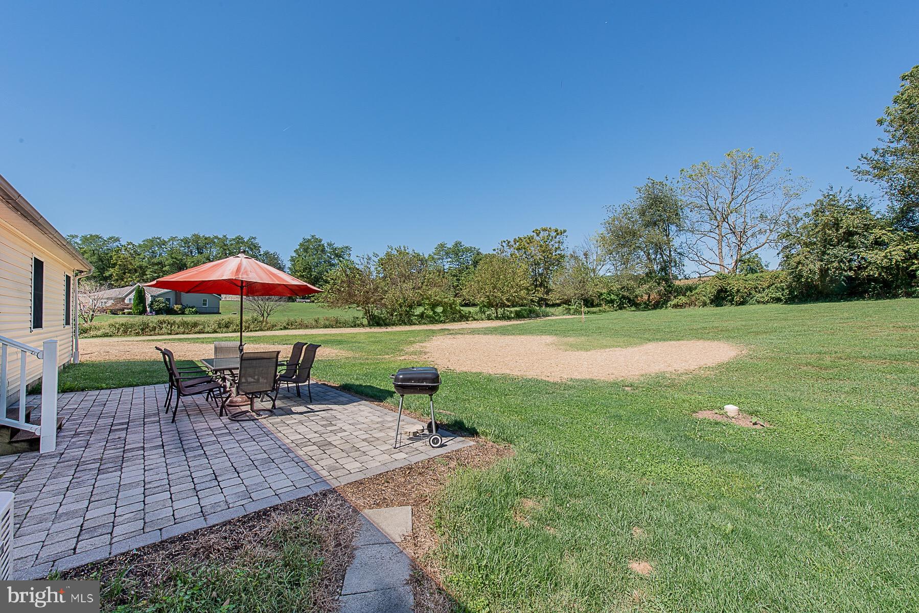 4000 Bark Hill Road Union Bridge, MD 21791 - Photo 44 of 61 a view of a table and chairs under an umbrella
