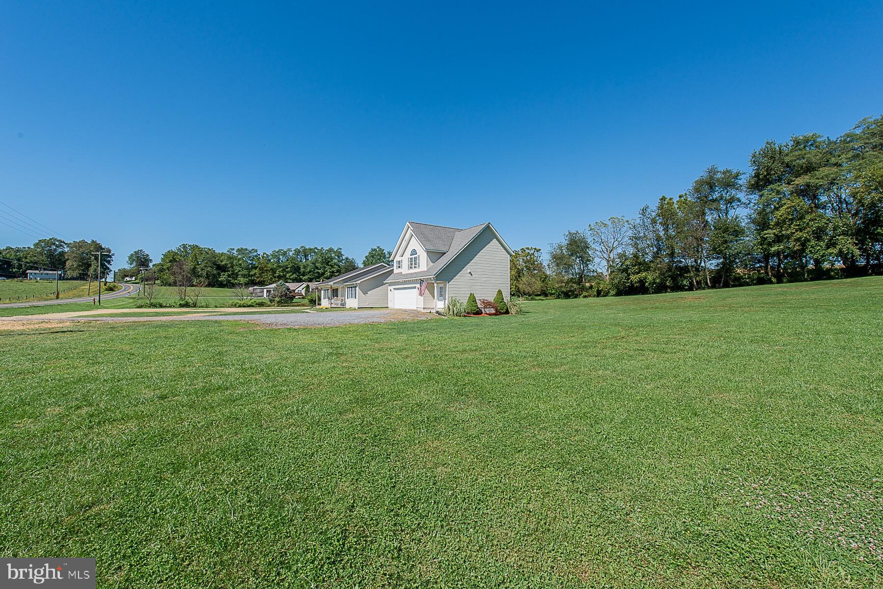4000 Bark Hill Road Union Bridge, MD 21791 - Photo 7 of 61 a view of a green field with house in the background