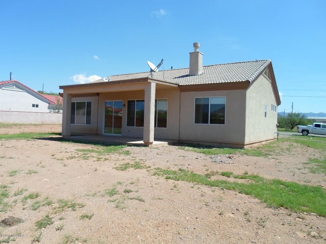 1834 Via Nevada Rio Rico, AZ 85648 - Photo 2 of 10 a front view of a house with a yard