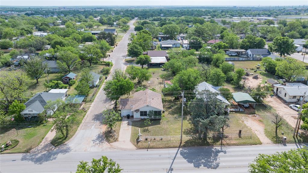 2841 Old Anson Road Abilene, TX 79603 - Photo 22 of 34 Aerial view showcasing the property situated on a corner lot with a paved driveway and mature trees