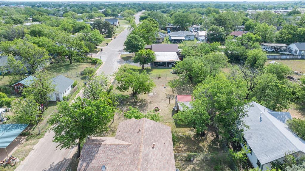 2841 Old Anson Road Abilene, TX 79603 - Photo 24 of 34 Aerial view showcasing the property's surrounding neighborhood with mature trees and a residential street