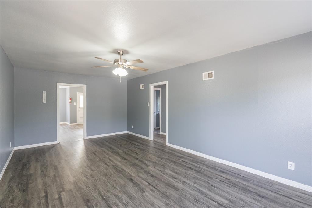 2841 Old Anson Road Abilene, TX 79603 - Photo 33 of 34 Spacious interior featuring wood-look flooring and a ceiling fan with integrated lighting