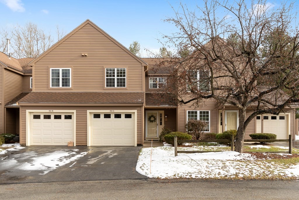 512 Ridgefield Circle, Unit C Clinton, MA 01510 - Photo 1 of 28 a front view of a house with a yard