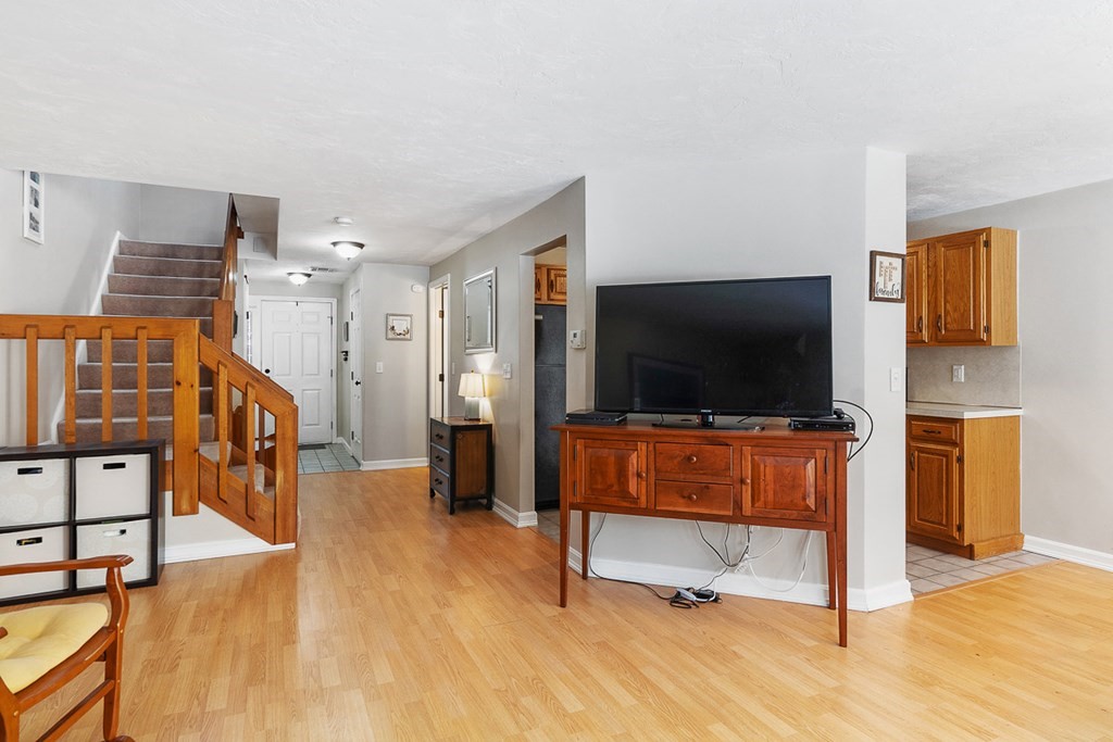 512 Ridgefield Circle, Unit C Clinton, MA 01510 - Photo 11 of 28 a living room with furniture and a flat screen tv