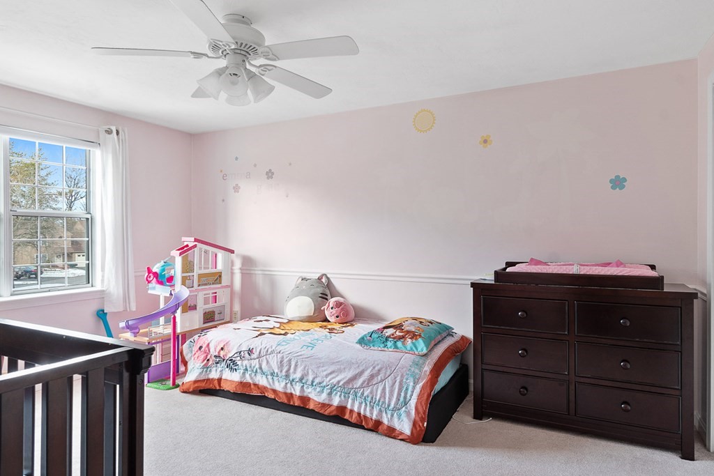 512 Ridgefield Circle, Unit C Clinton, MA 01510 - Photo 18 of 28 a bedroom with a bed and a window