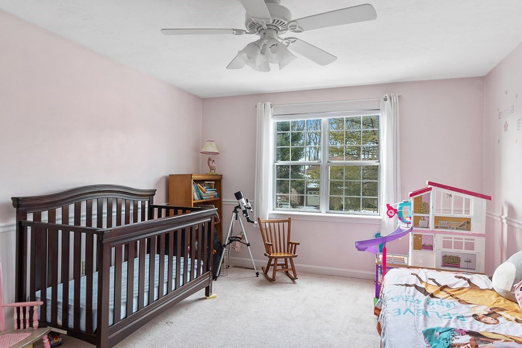 512 Ridgefield Circle, Unit C Clinton, MA 01510 - Photo 19 of 28 a bedroom with furniture and a window