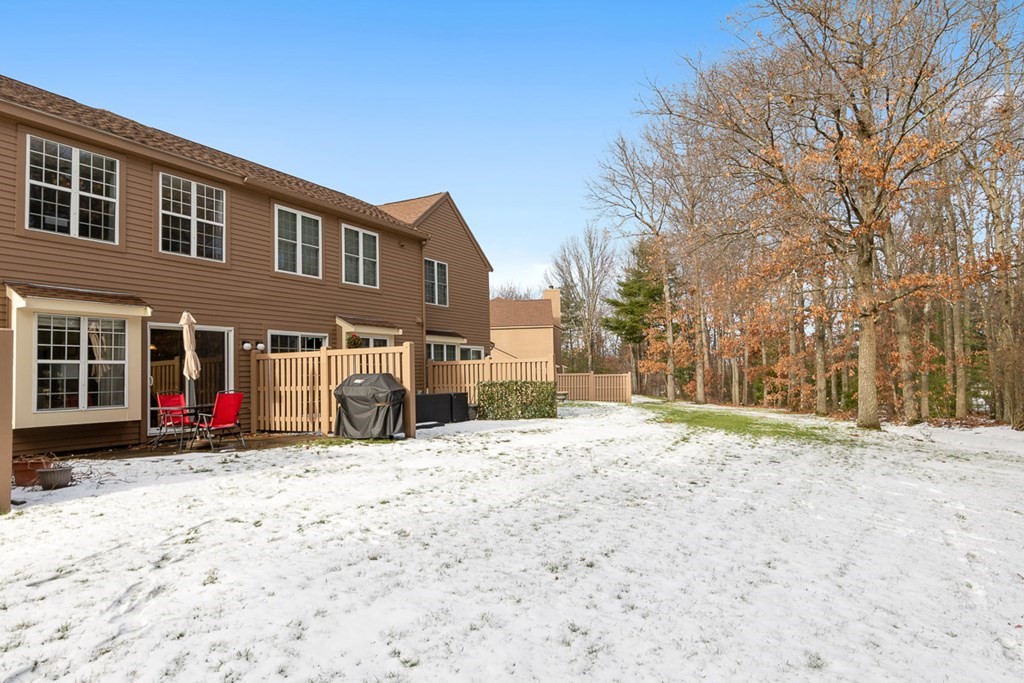 512 Ridgefield Circle, Unit C Clinton, MA 01510 - Photo 22 of 28 a view of a house with snow on the side of the road