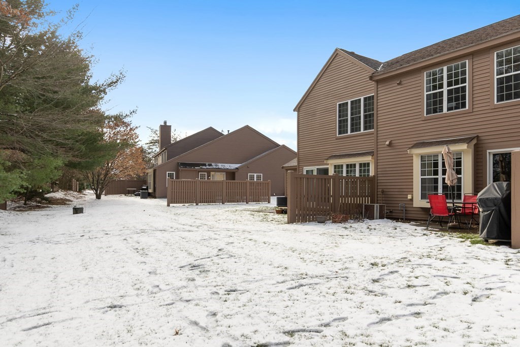 512 Ridgefield Circle, Unit C Clinton, MA 01510 - Photo 23 of 28 a view of a house covered in snow
