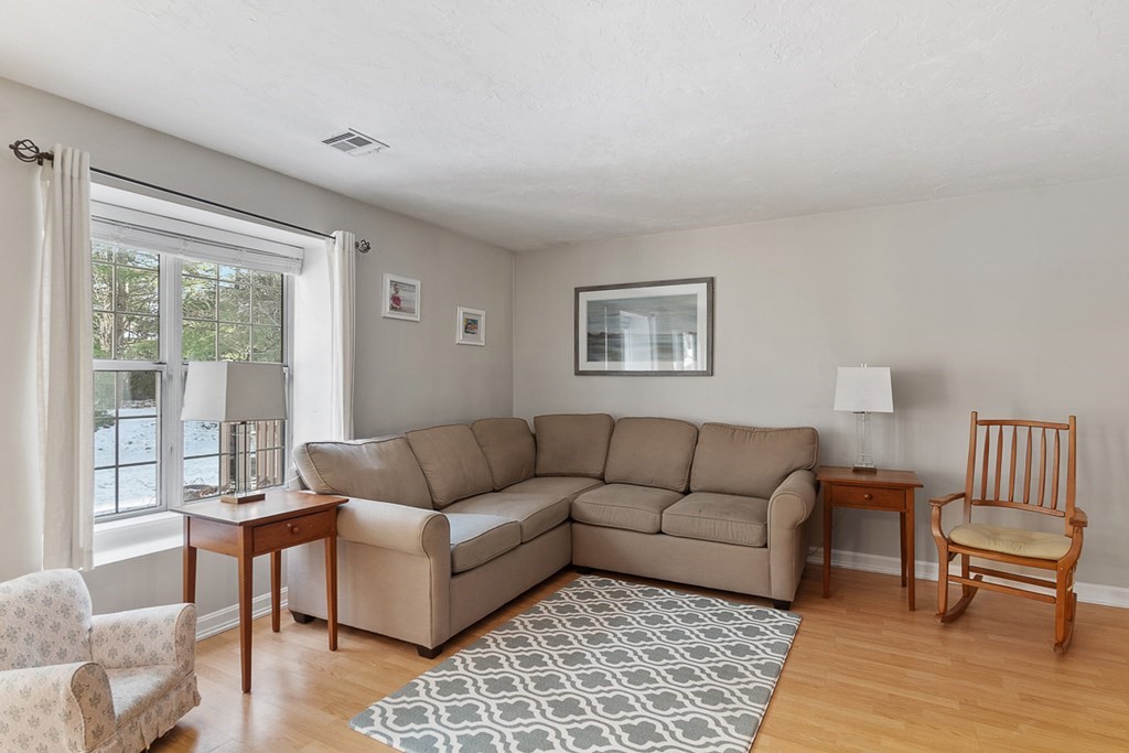 512 Ridgefield Circle, Unit C Clinton, MA 01510 - Photo 9 of 28 a living room with furniture and a rug