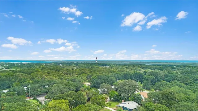 a view of a big yard with lots of green space and mountain view