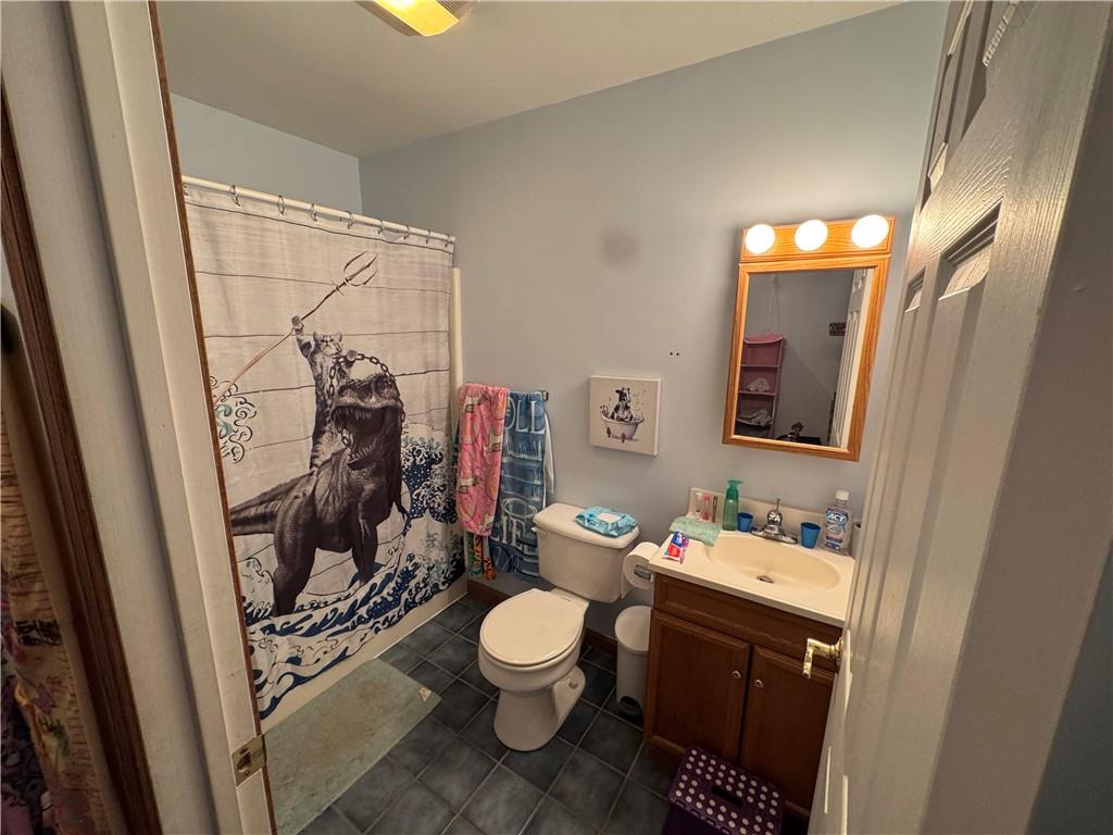 526 East River Road Edinburg, PA 16116 - Photo 19 of 39 a bathroom with a toilet sink and mirror