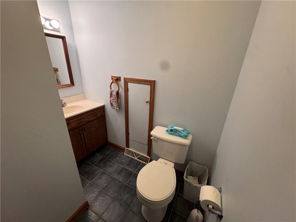 526 East River Road Edinburg, PA 16116 - Photo 26 of 39 a white toilet sitting next to a small sink