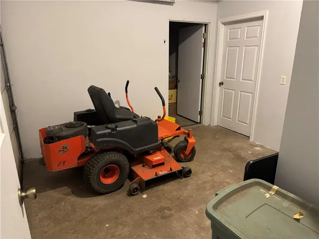 a living room with furniture and a book shelf