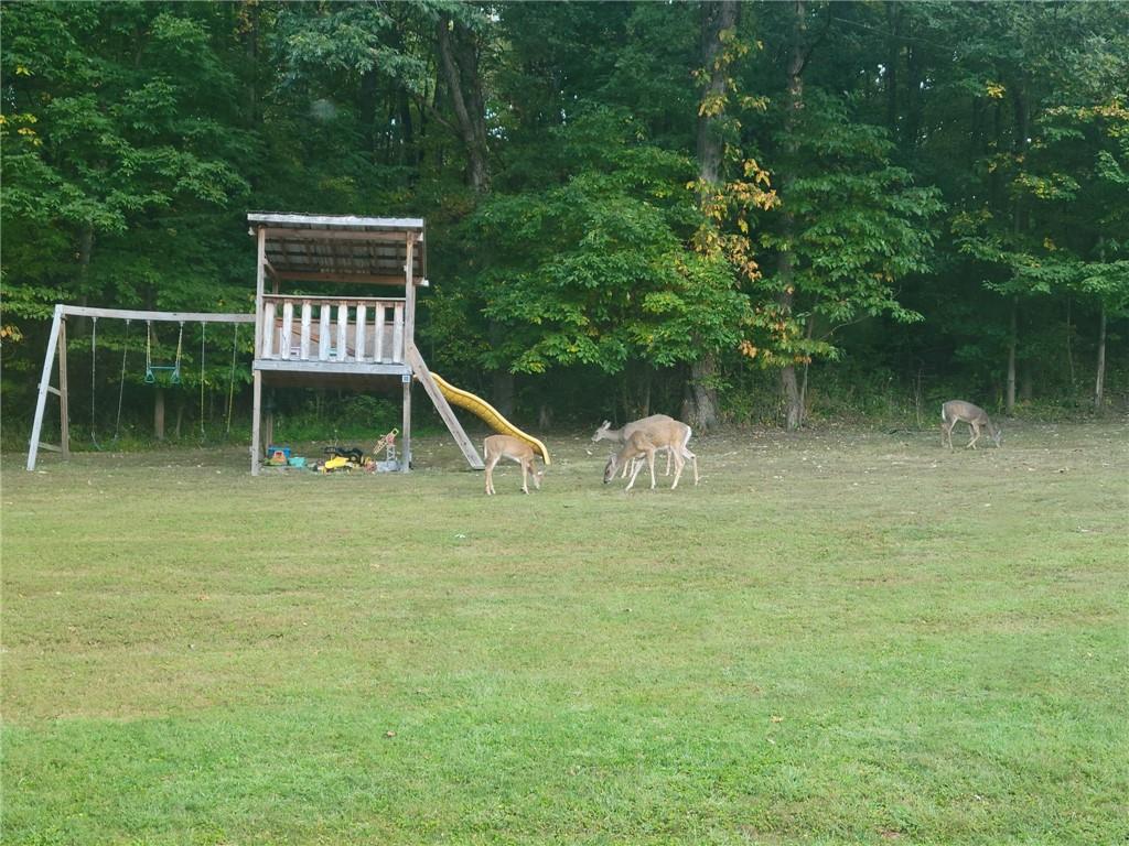 526 East River Road Edinburg, PA 16116 - Photo 36 of 39 a view of a wooden fence and a bench
