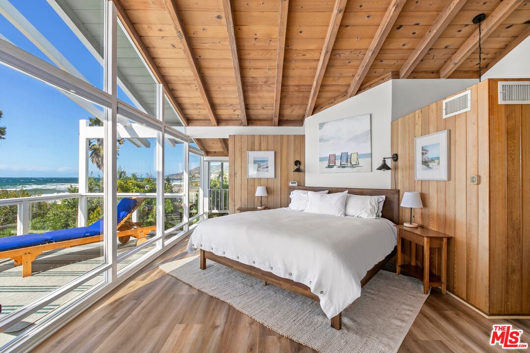 30800 Broad Beach Road Malibu, CA 90265 - Photo 21 of 31 a large room with bed and large windows