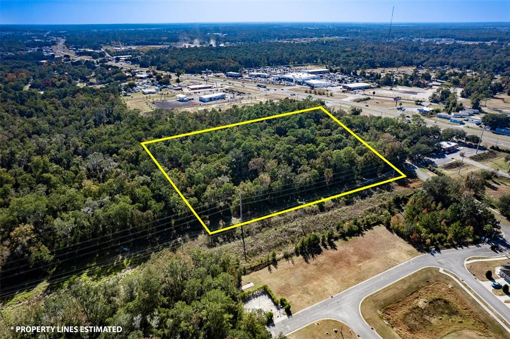 441 West Anthony Road Ocala, FL 34475 - Photo 18 of 19 an aerial view of a house with a yard and lake view