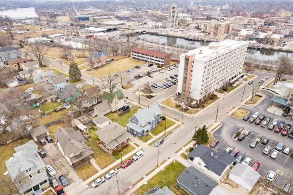 an aerial view of residential houses with yard