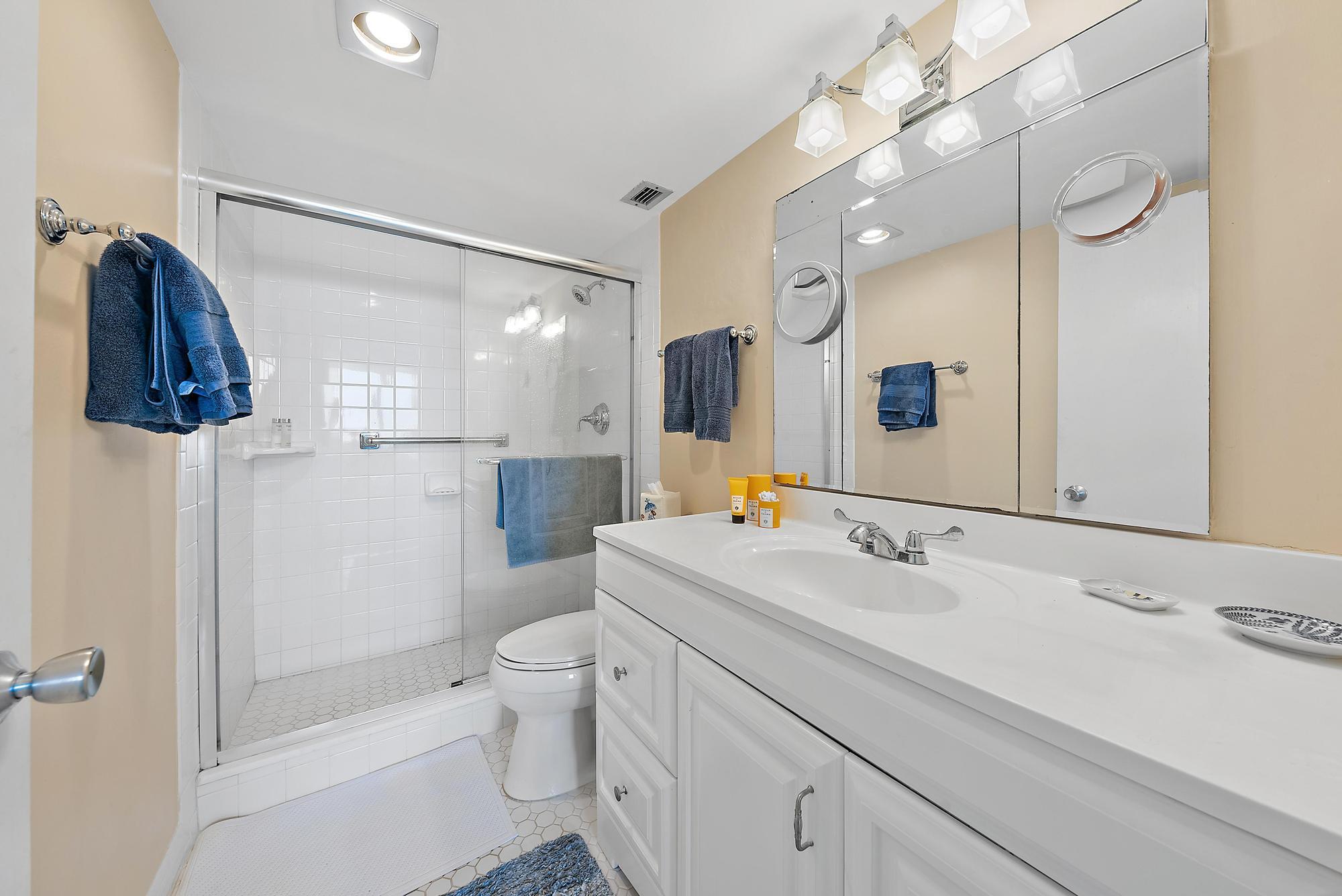1801 South Flagler Drive, Unit 1206 West Palm Beach, FL 33401 - Photo 13 of 20 a bathroom with a sink a toilet and shower