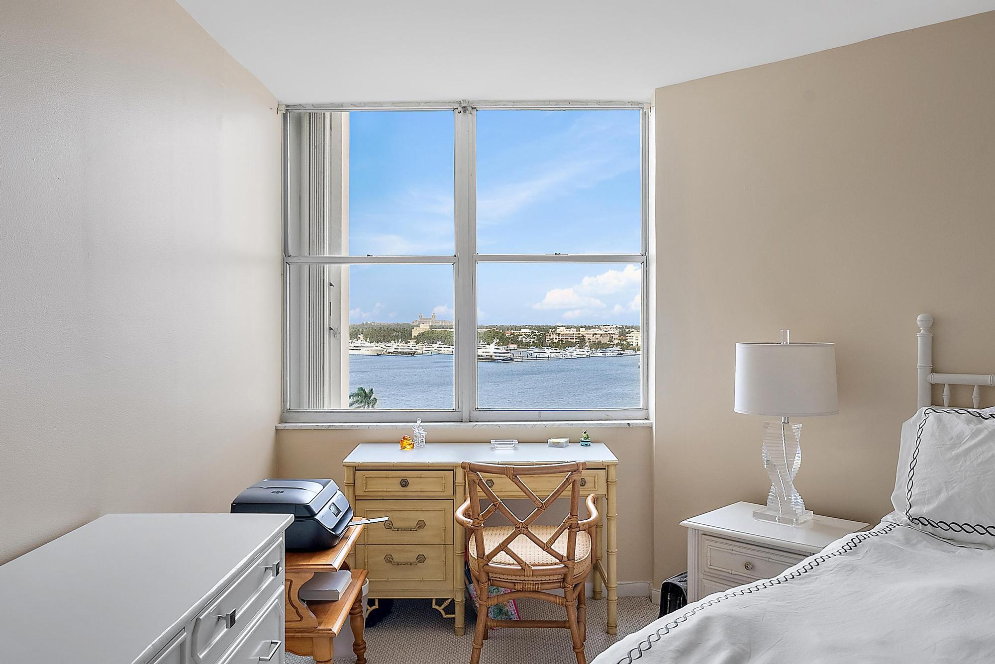 1801 South Flagler Drive, Unit 1206 West Palm Beach, FL 33401 - Photo 10 of 20 a living room with a couch and a table