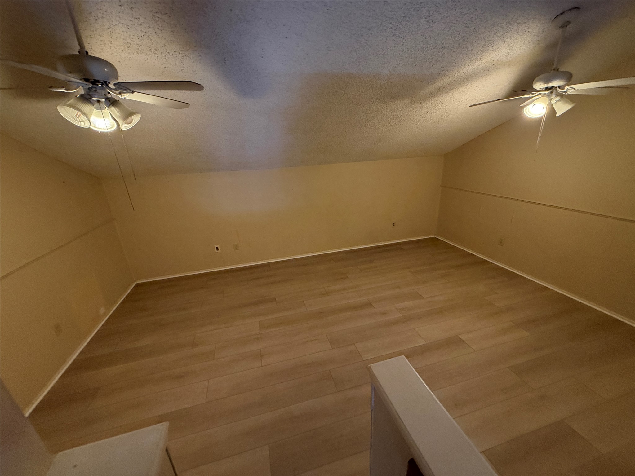 2500 Burleson Road, Unit 221 Austin, TX 78741 - Photo 2 of 18 Additional living space with ceiling fan and wood finished floors