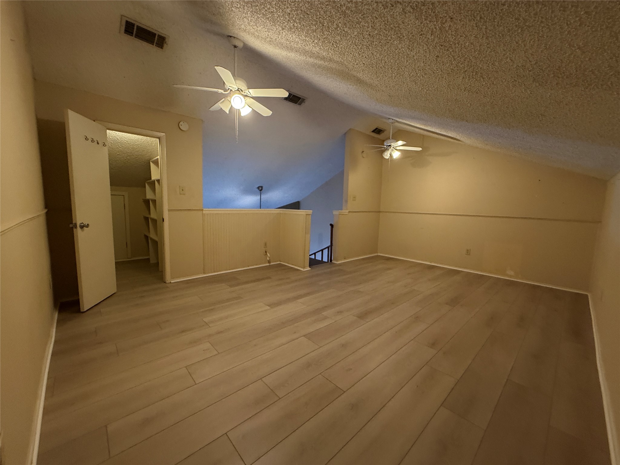 2500 Burleson Road, Unit 221 Austin, TX 78741 - Photo 3 of 18 Additional living space with light wood finished floors and a ceiling fan