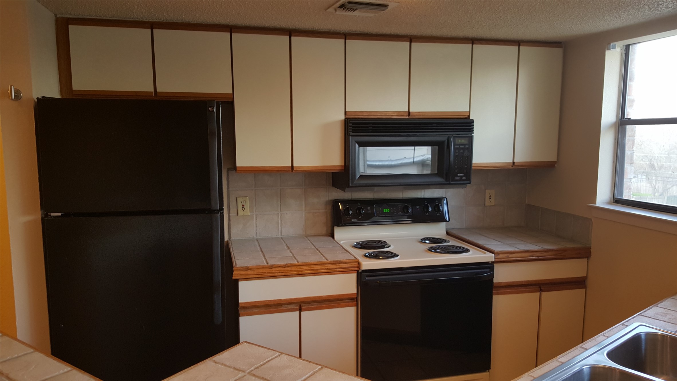 2500 Burleson Road, Unit 221 Austin, TX 78741 - Photo 8 of 18 The range was replaced Feb 2026; black smooth top
