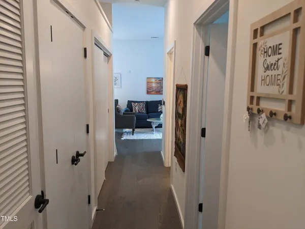 a view of a hallway with elevator and glass door