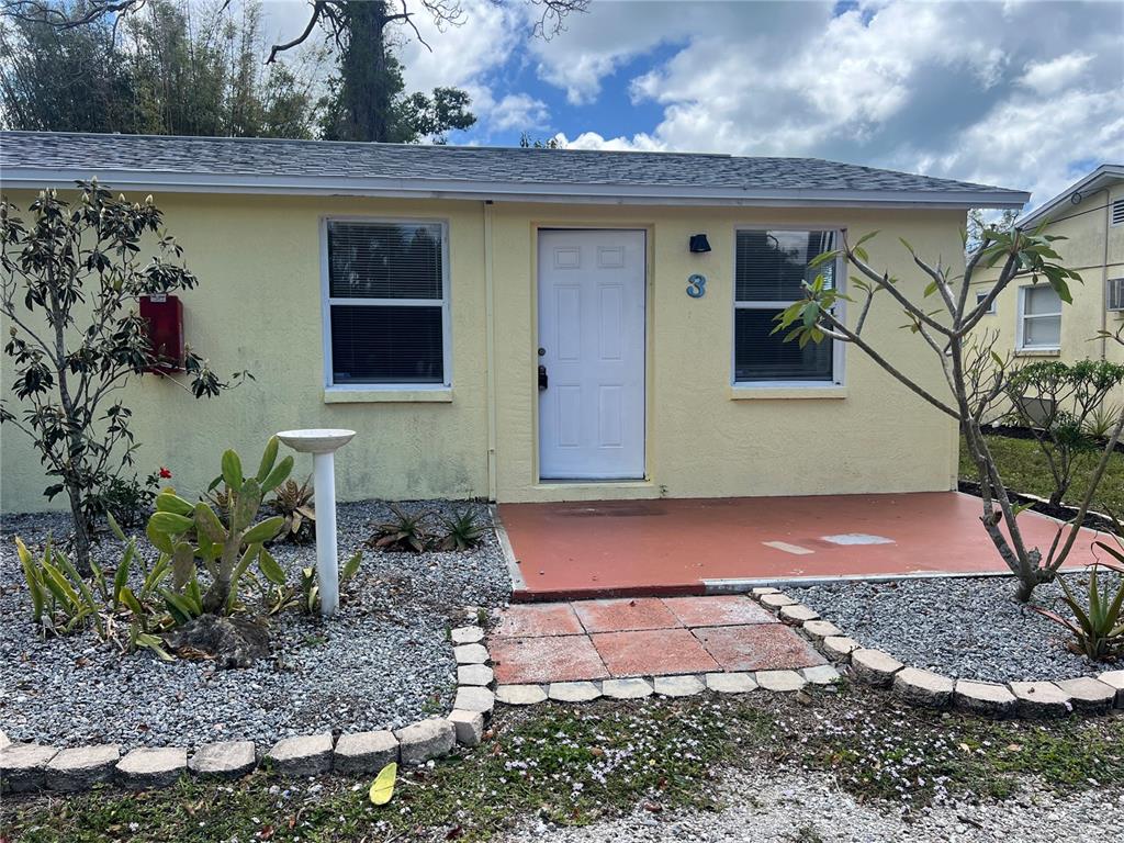 255 Pineapple Street, Unit 3 Englewood, FL 34223 - Photo 2 of 7 a front view of house with yard