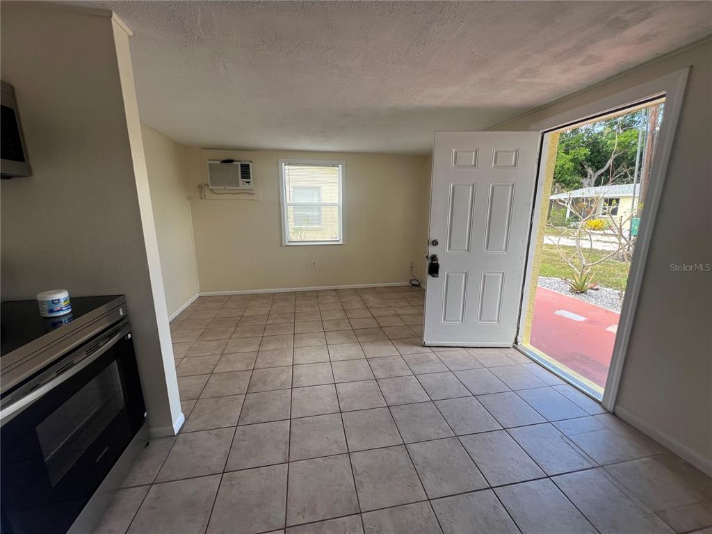 255 Pineapple Street, Unit 3 Englewood, FL 34223 - Photo 3 of 7 a view of an empty room with a window
