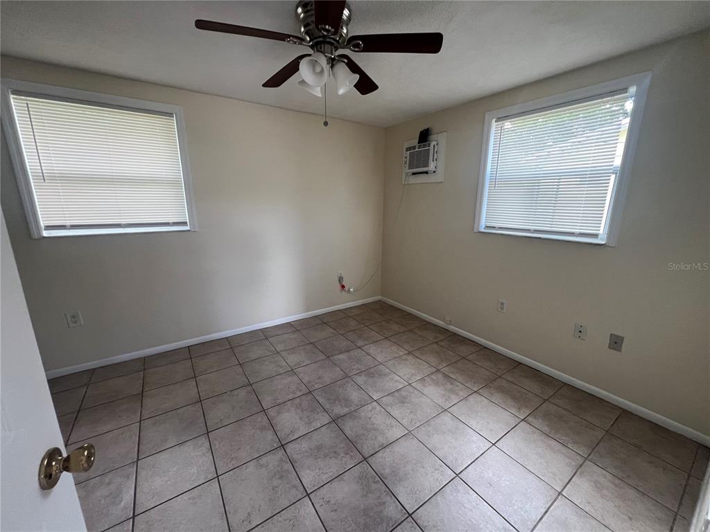 255 Pineapple Street, Unit 3 Englewood, FL 34223 - Photo 5 of 7 a view of an empty room and window