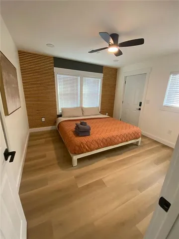 a bedroom with a bed and window