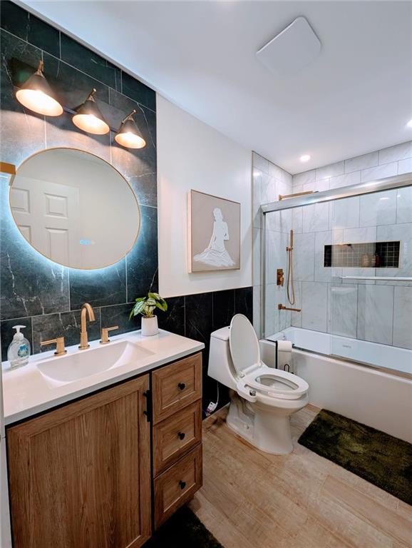 10 Burnett Ferry Road Southwest Rome, GA 30165 - Photo 24 of 25 a bathroom with a double vanity sink toilet and mirror