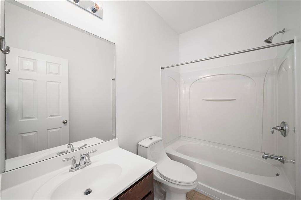 3628 Ashcroft Bend Atlanta, GA 30319 - Photo 35 of 44 a bathroom with a sink a toilet and shower