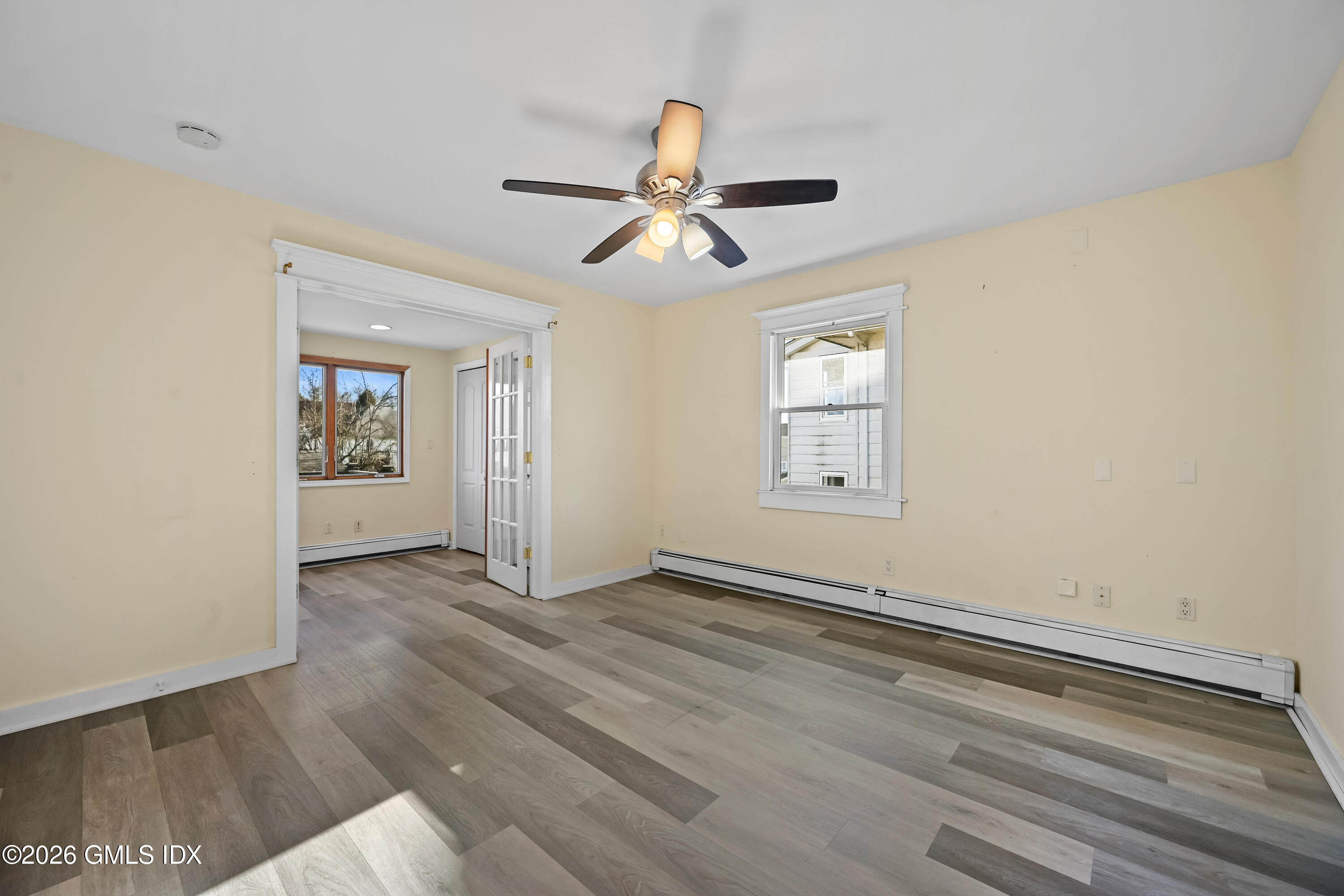 11 Bible Street Cos Cob, CT 06807 - Photo 12 of 25 wooden floor in an empty room with a window