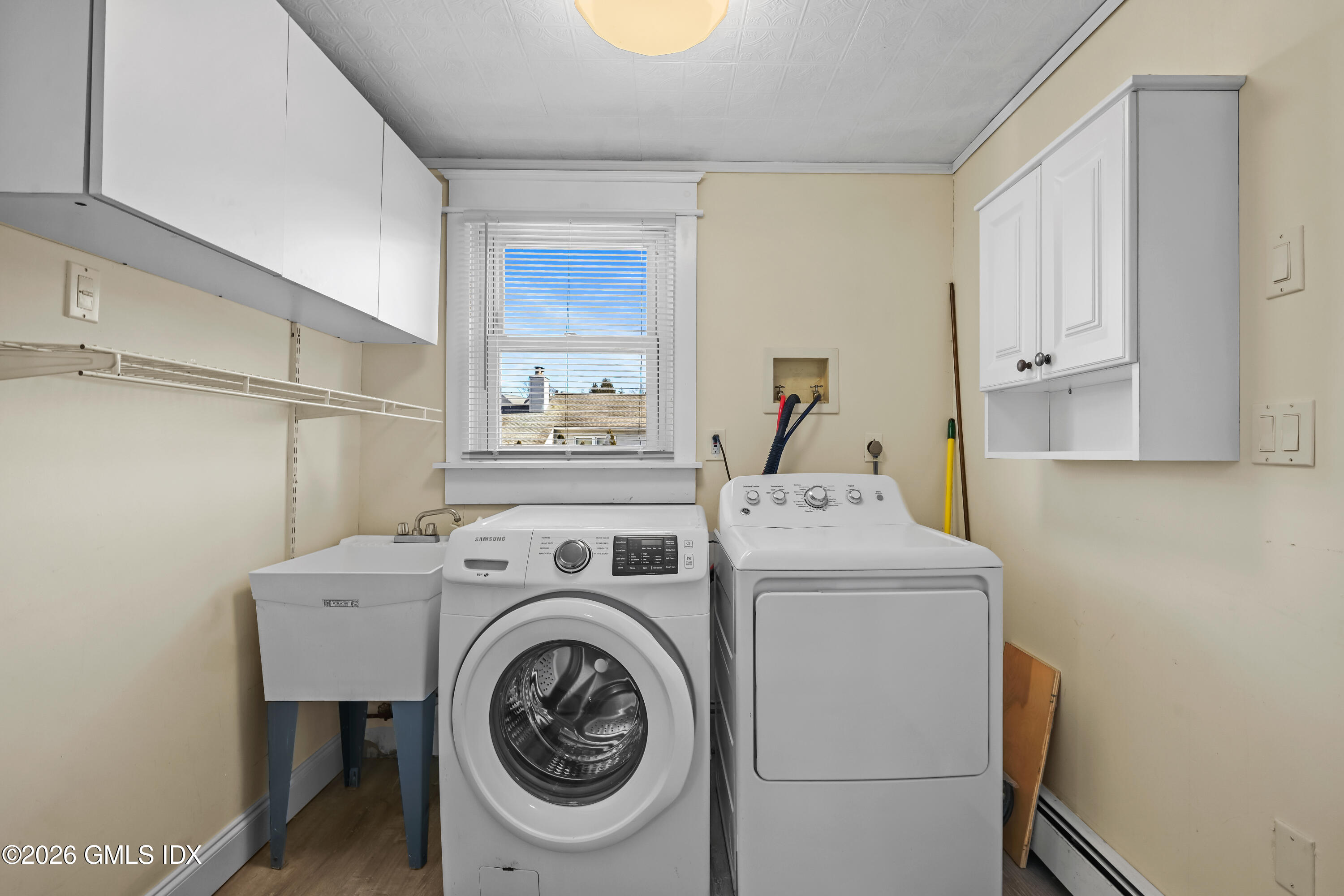 11 Bible Street Cos Cob, CT 06807 - Photo 18 of 25 a utility room with dryer and washer