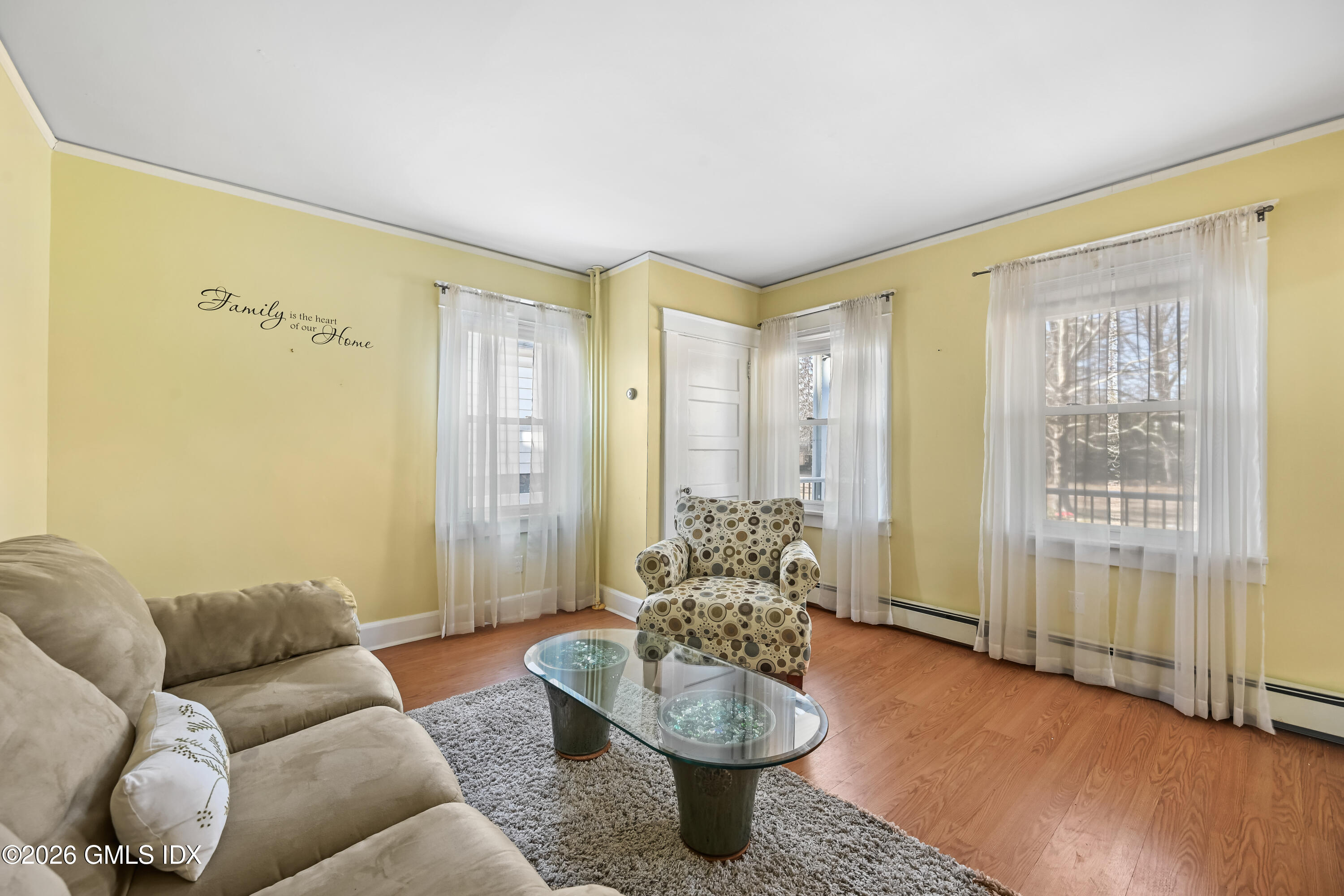 11 Bible Street Cos Cob, CT 06807 - Photo 4 of 25 a living room with furniture and a potted plant