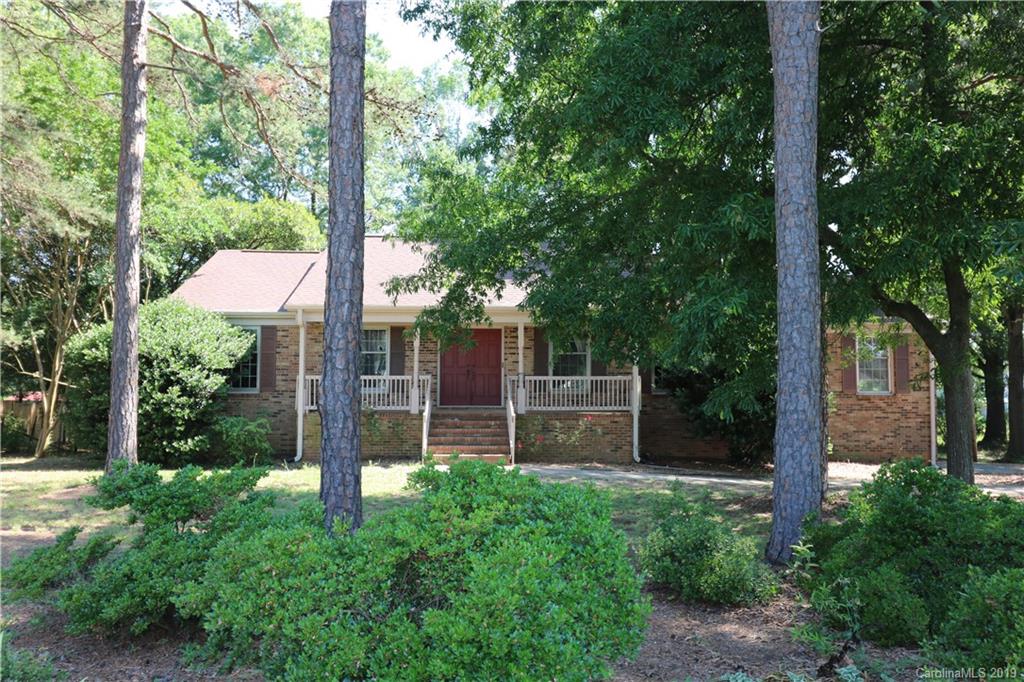 2302 Goldmine Road Monroe, NC 28110 - Photo 1 of 27 a view of a backyard with potted plants and large trees