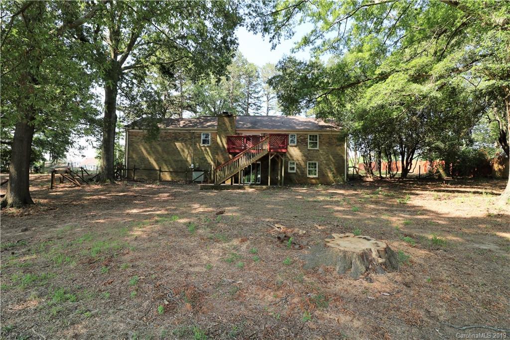 2302 Goldmine Road Monroe, NC 28110 - Photo 4 of 27 a view of outdoor space with deck and tree