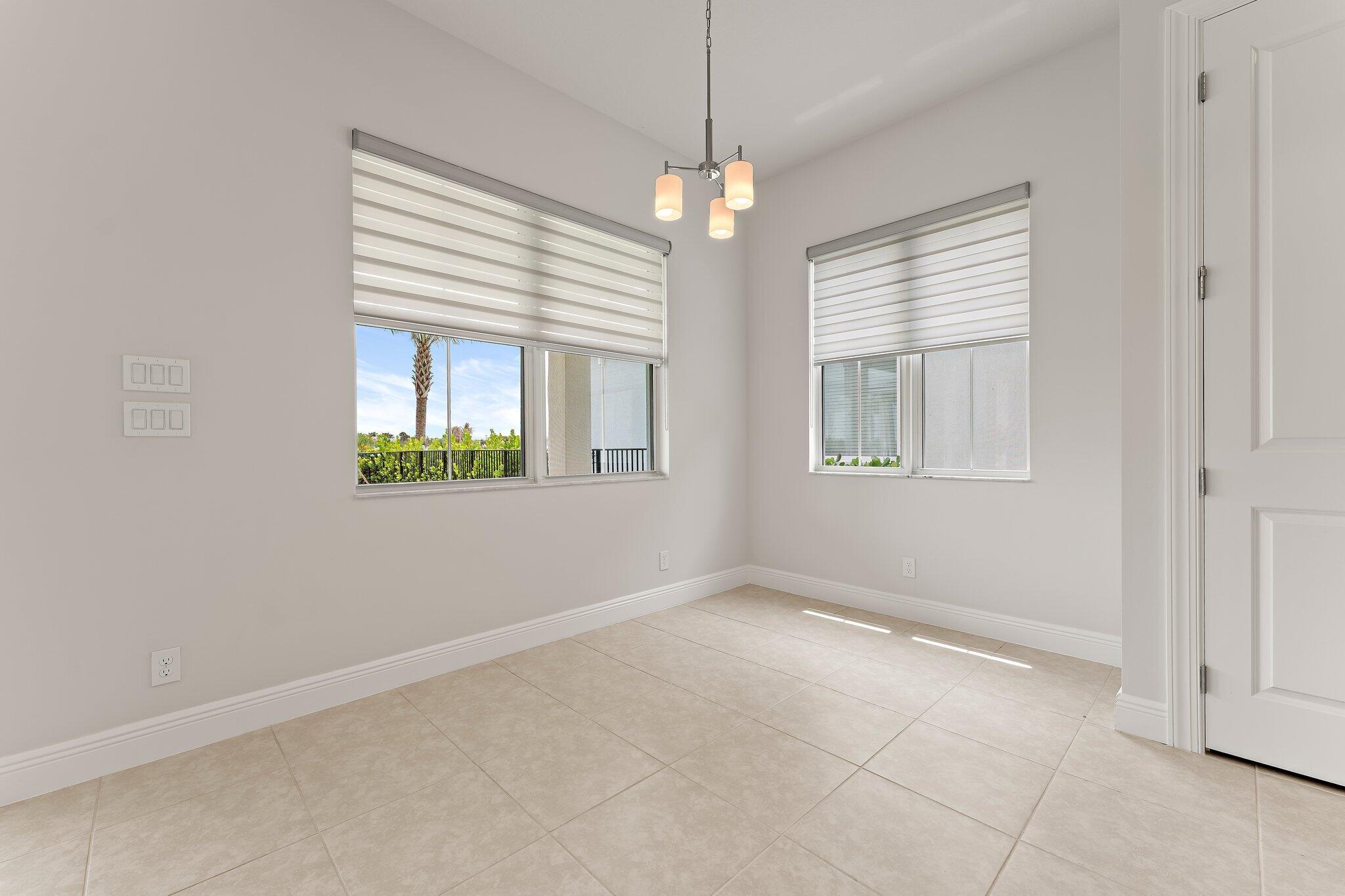 12622 Nautilus Circle Palm Beach Gardens, FL 33412 - Photo 16 of 66 a view of an empty room with a window