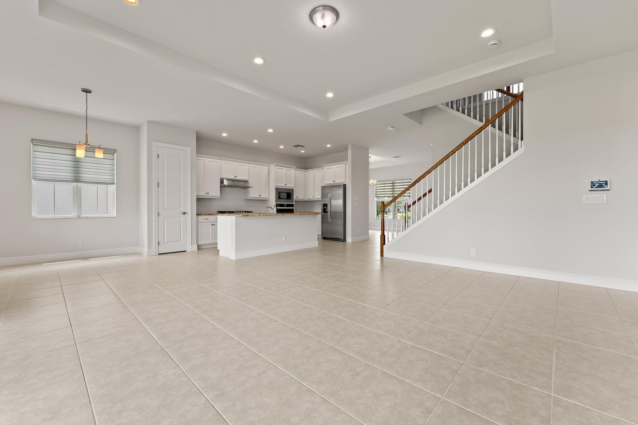 12622 Nautilus Circle Palm Beach Gardens, FL 33412 - Photo 18 of 66 a view of a kitchen with furniture and wooden floor