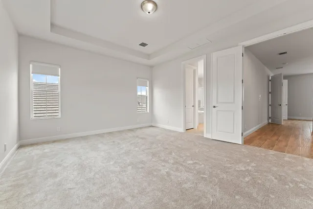 a spacious bathroom with a granite countertop tub sink and mirror