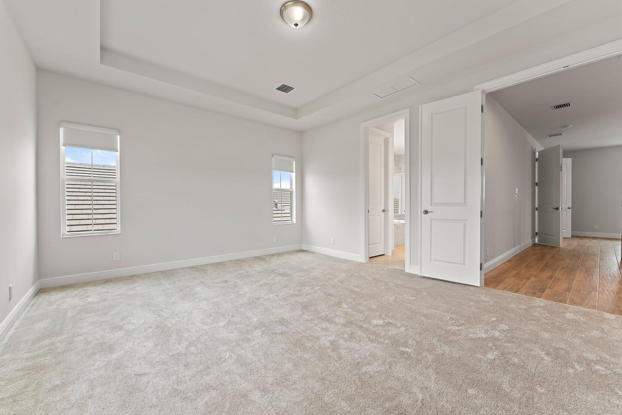 12622 Nautilus Circle Palm Beach Gardens, FL 33412 - Photo 27 of 66 a view of an empty room with window and closet area