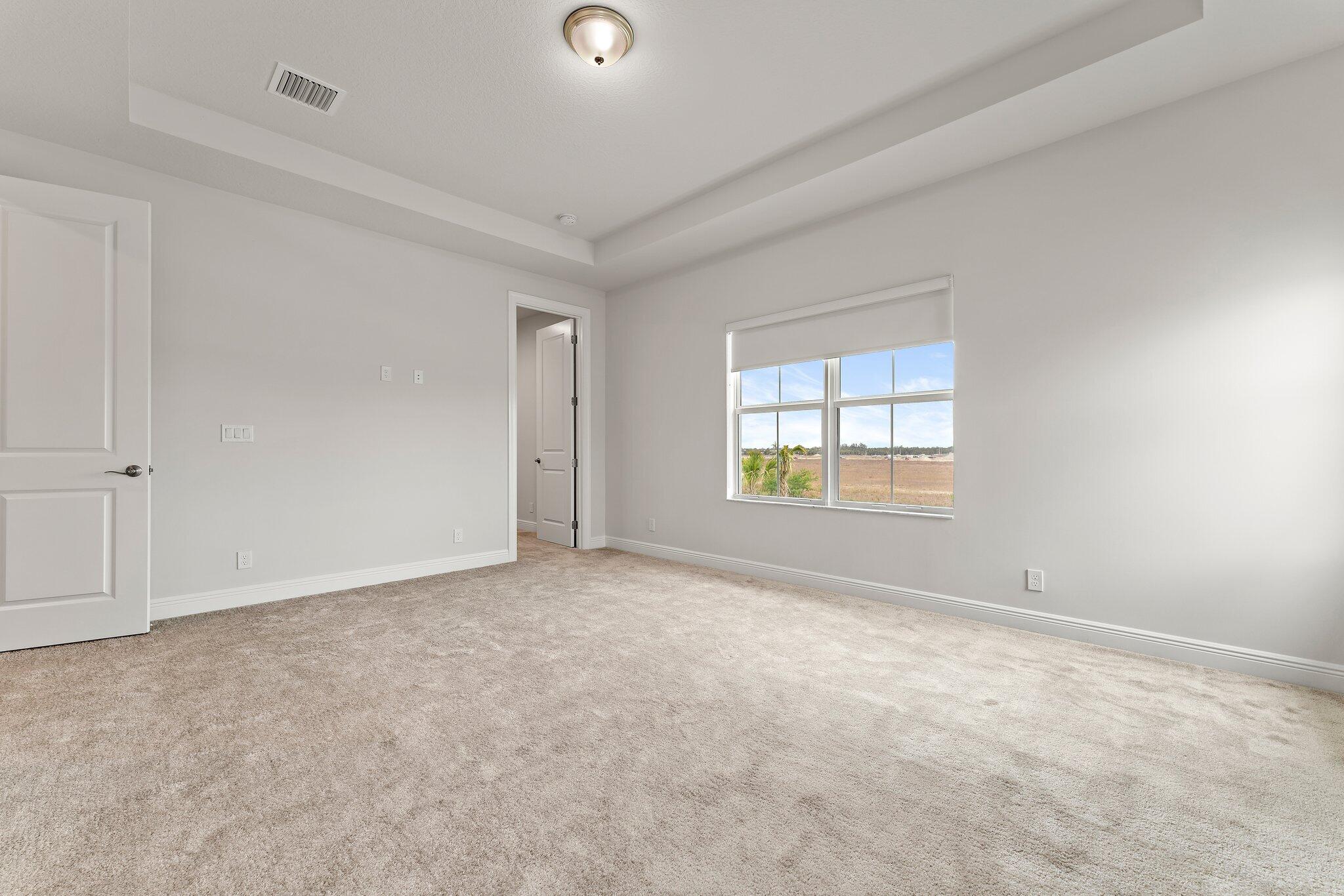 12622 Nautilus Circle Palm Beach Gardens, FL 33412 - Photo 29 of 66 an empty room with windows
