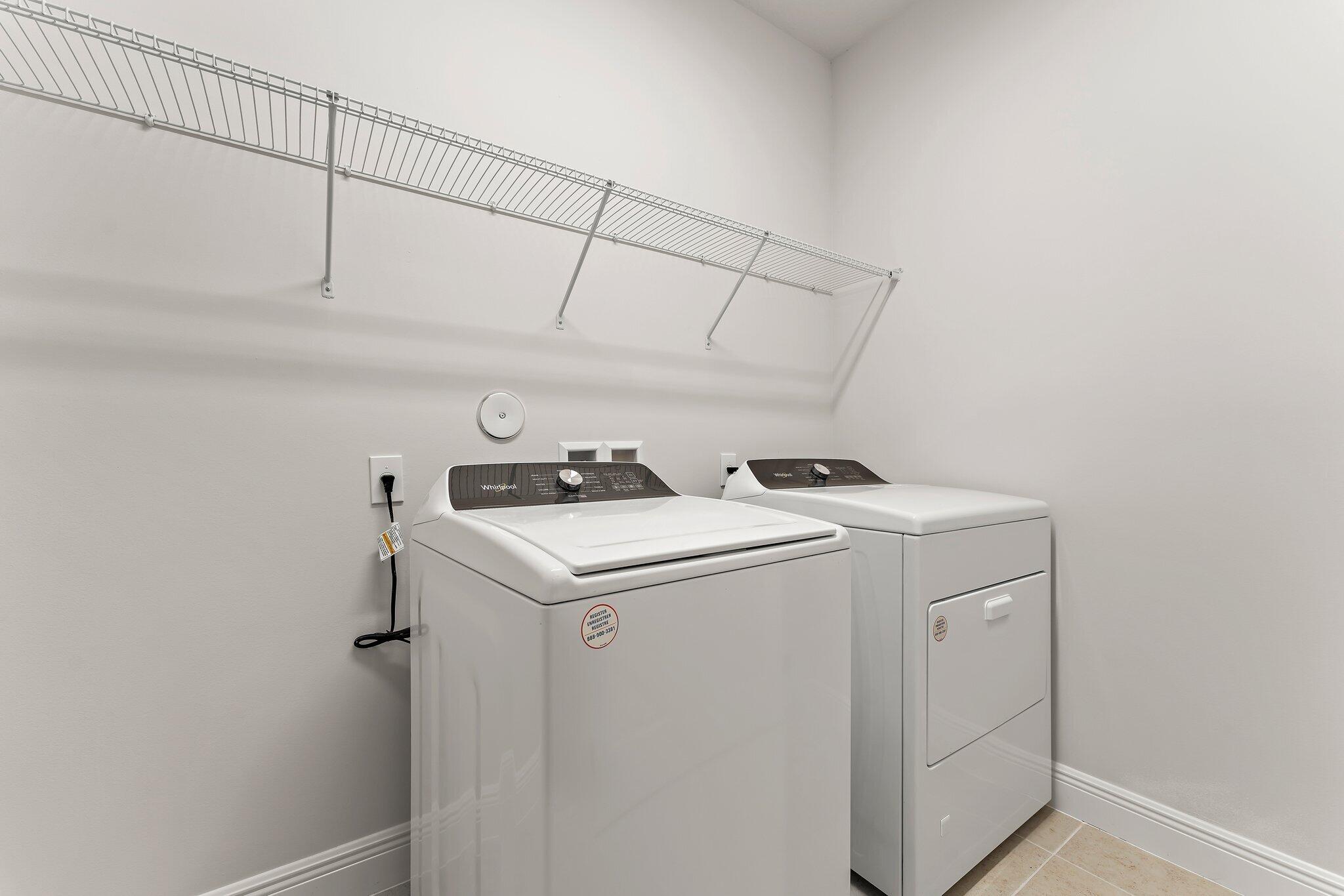 12622 Nautilus Circle Palm Beach Gardens, FL 33412 - Photo 34 of 66 a utility room with dryer and washer