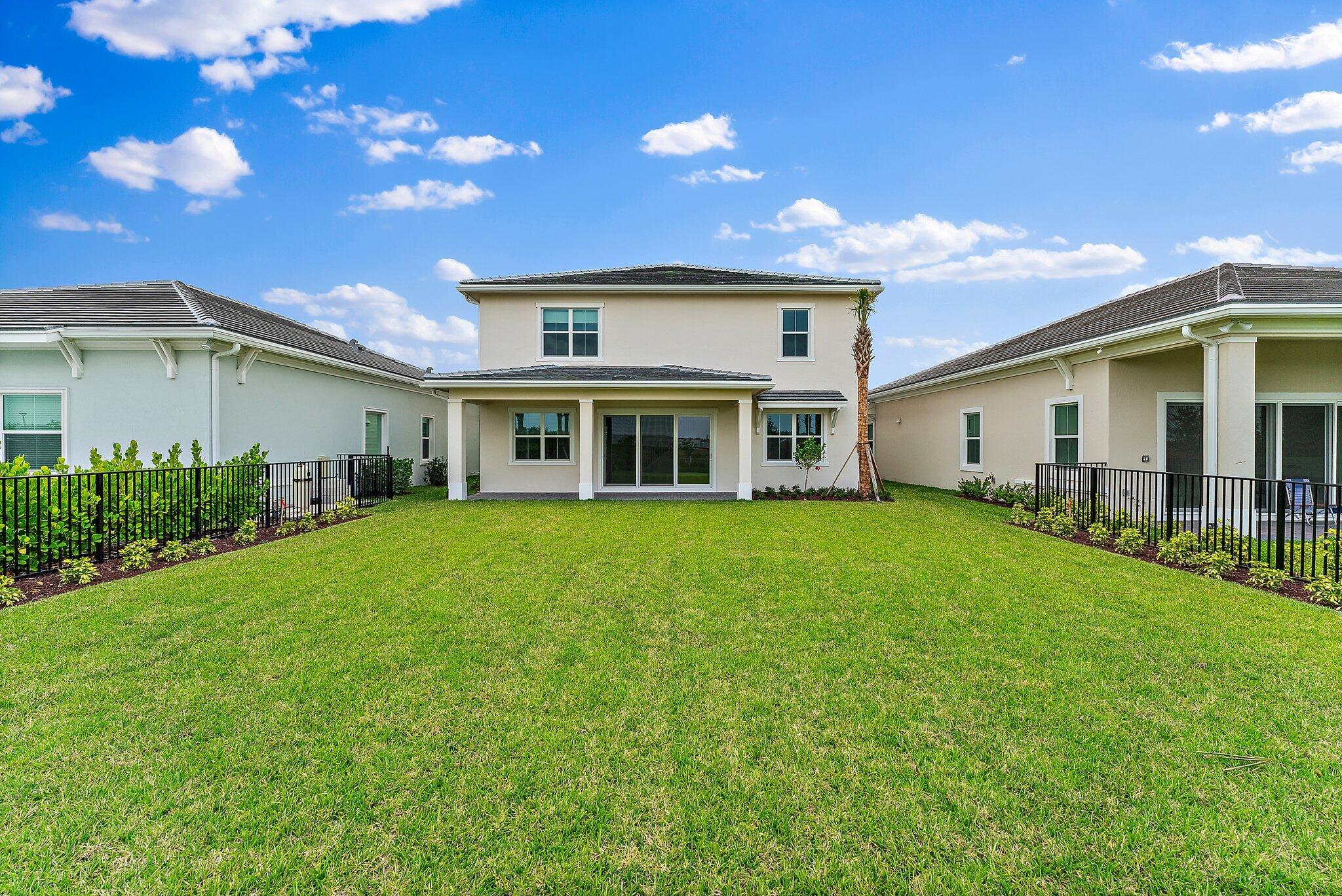 12622 Nautilus Circle Palm Beach Gardens, FL 33412 - Photo 47 of 66 a view of a yard in front of house