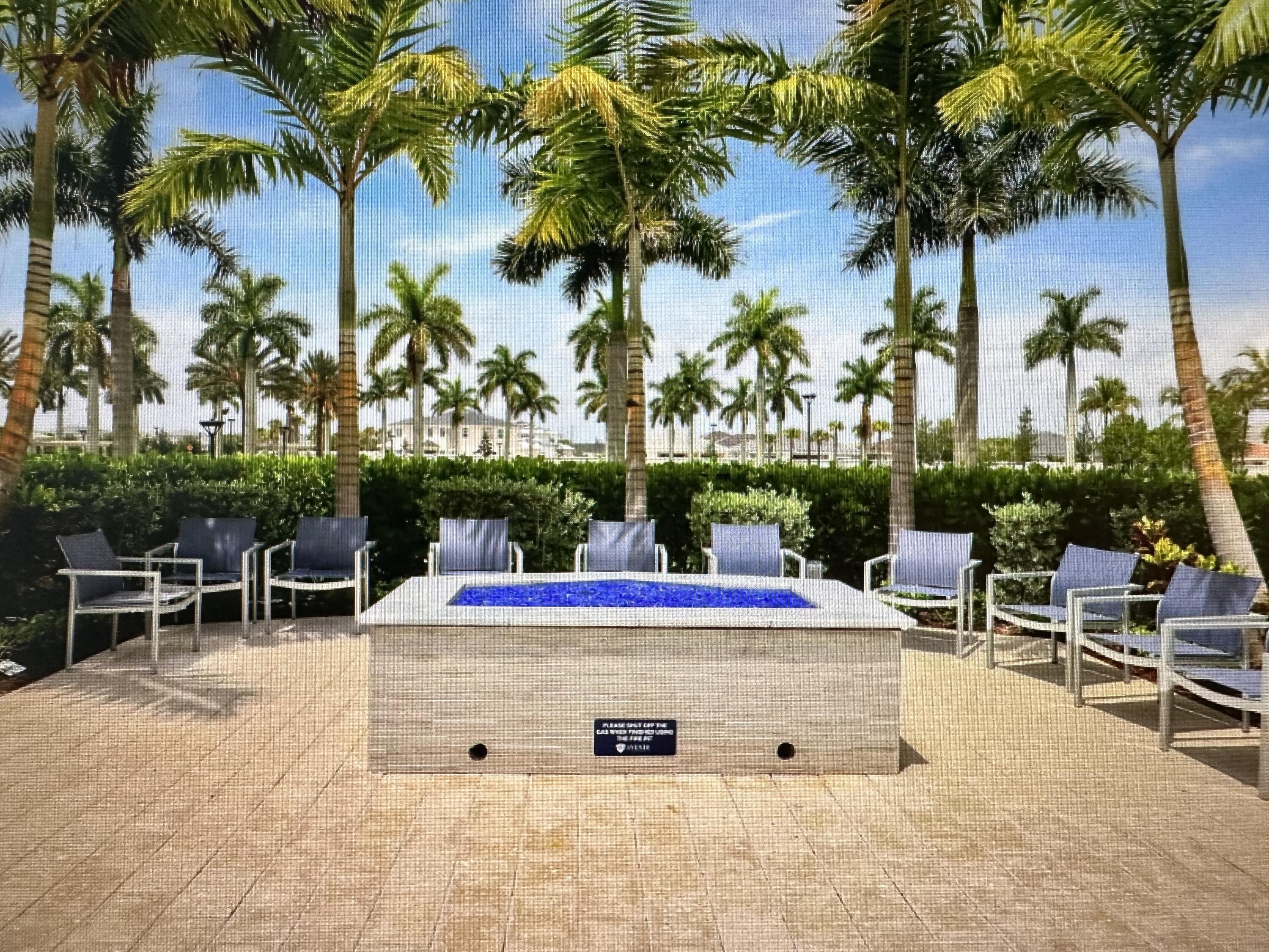 12622 Nautilus Circle Palm Beach Gardens, FL 33412 - Photo 50 of 66 a view of outdoor space with seating area and trees
