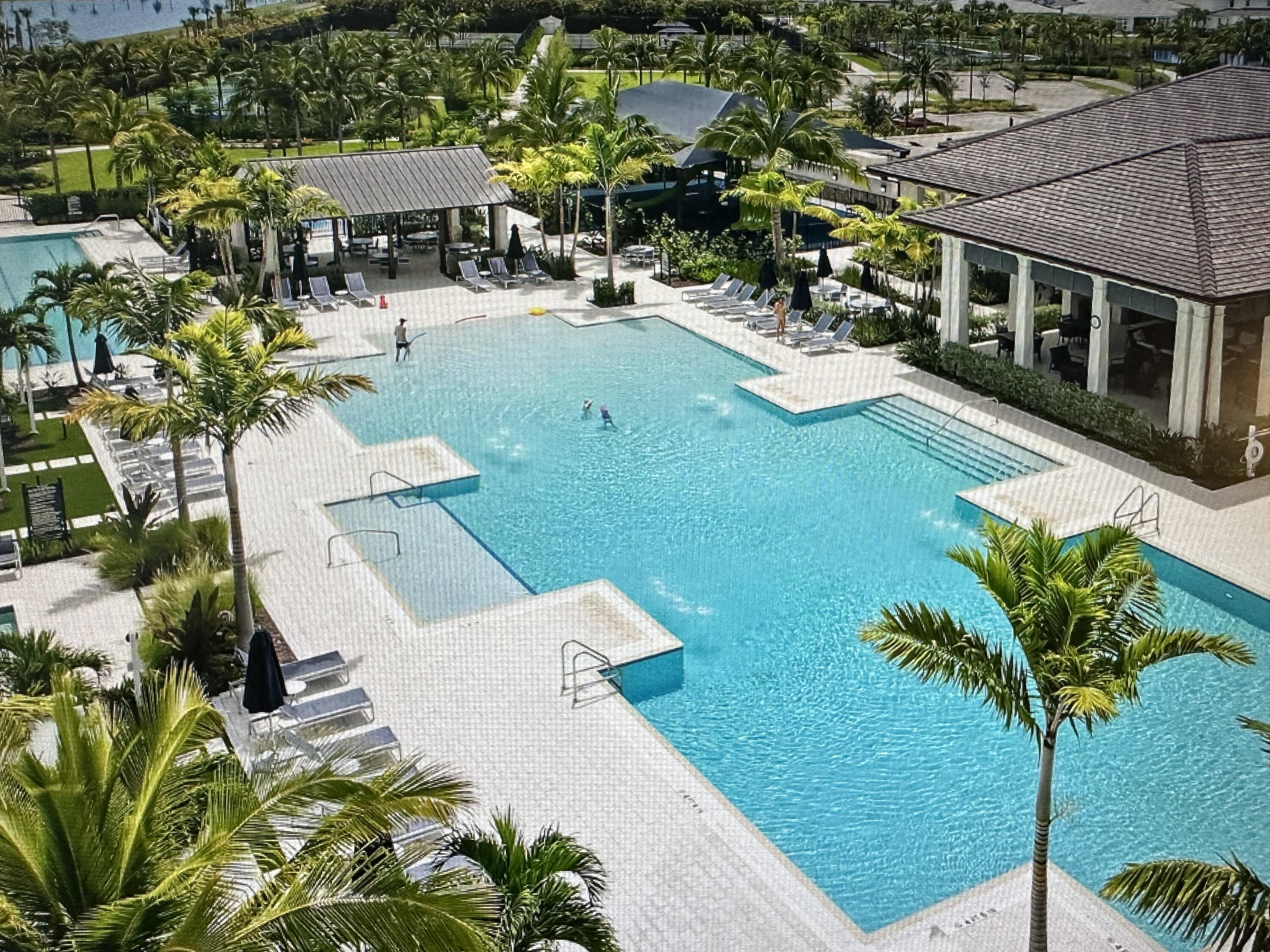 12622 Nautilus Circle Palm Beach Gardens, FL 33412 - Photo 51 of 66 an aerial view of a house with garden space and a patio
