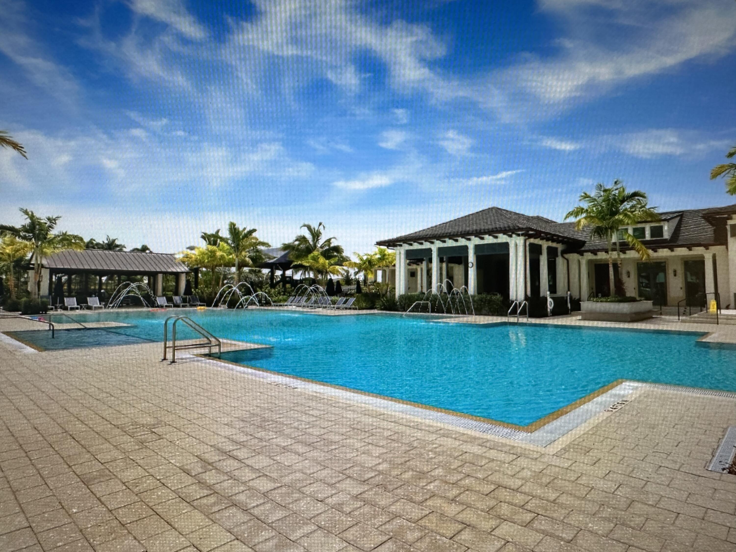 12622 Nautilus Circle Palm Beach Gardens, FL 33412 - Photo 57 of 66 a view of house with swimming pool outdoor seating