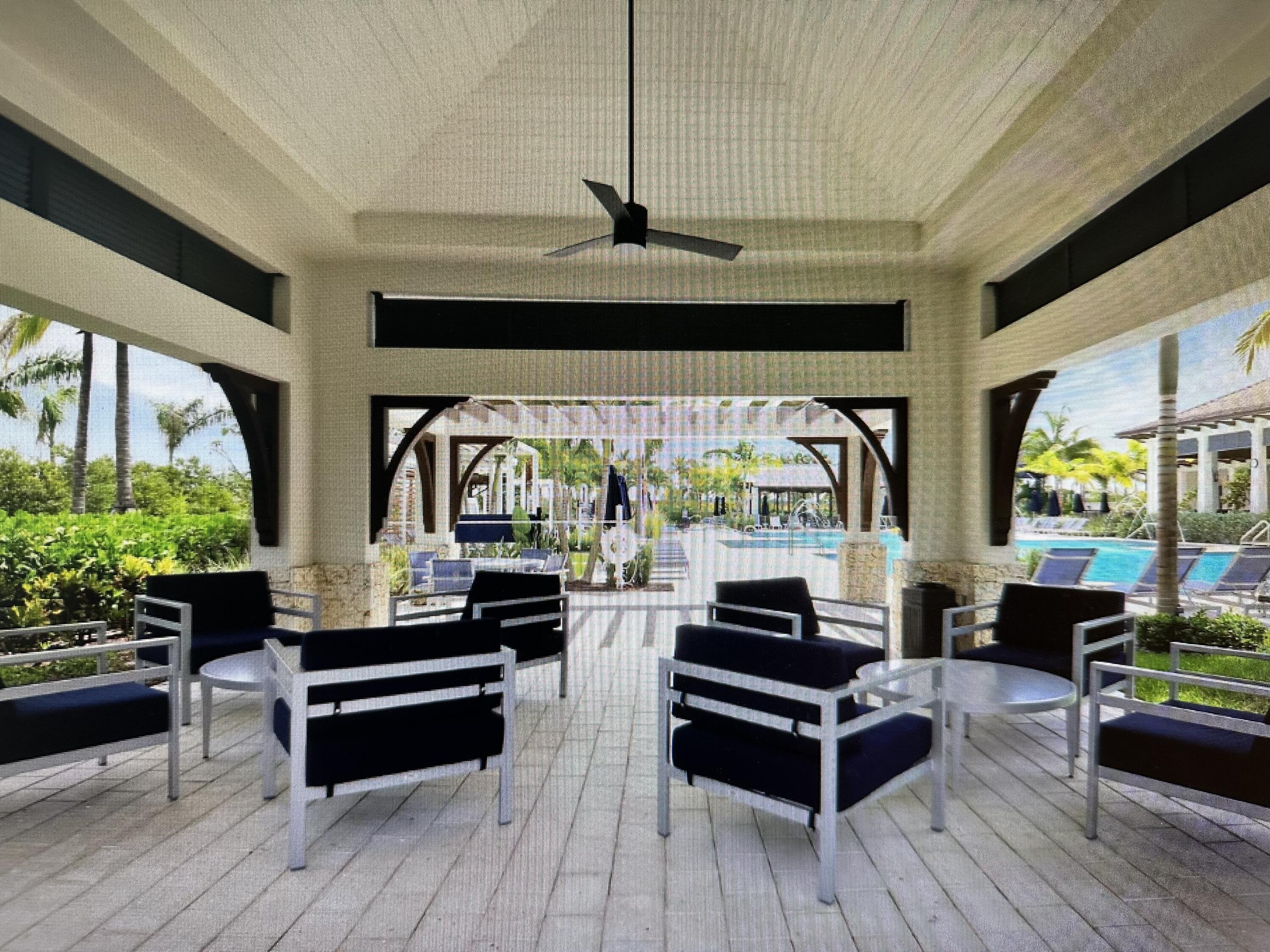 12622 Nautilus Circle Palm Beach Gardens, FL 33412 - Photo 59 of 66 a living room with furniture and a large window