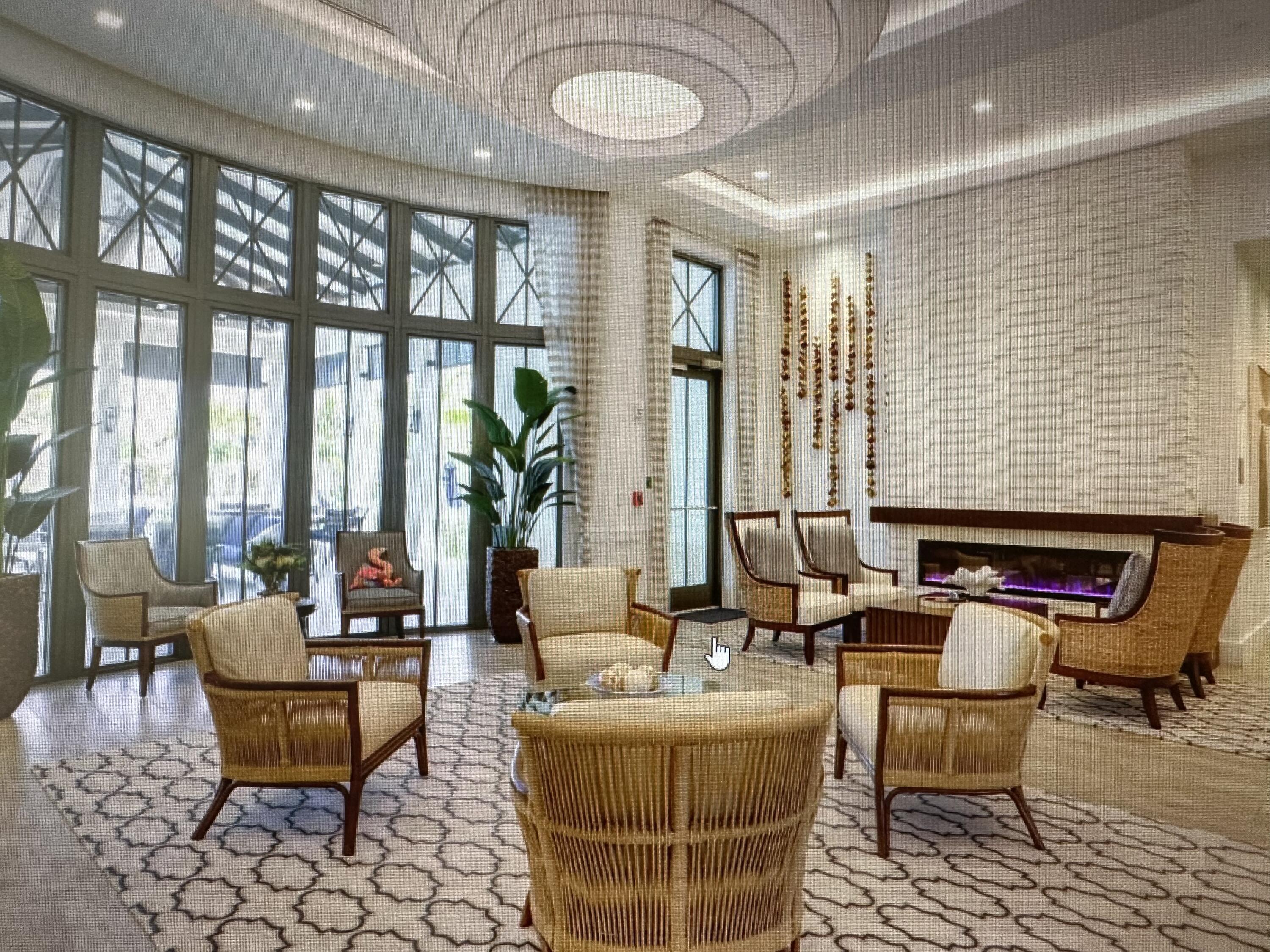 12622 Nautilus Circle Palm Beach Gardens, FL 33412 - Photo 65 of 66 a living room with furniture and floor to ceiling windows